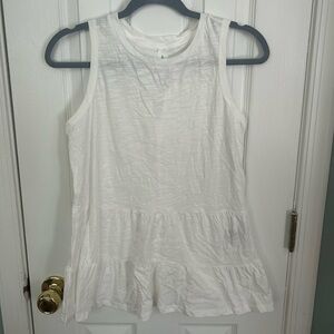 White tank top with open tie back.